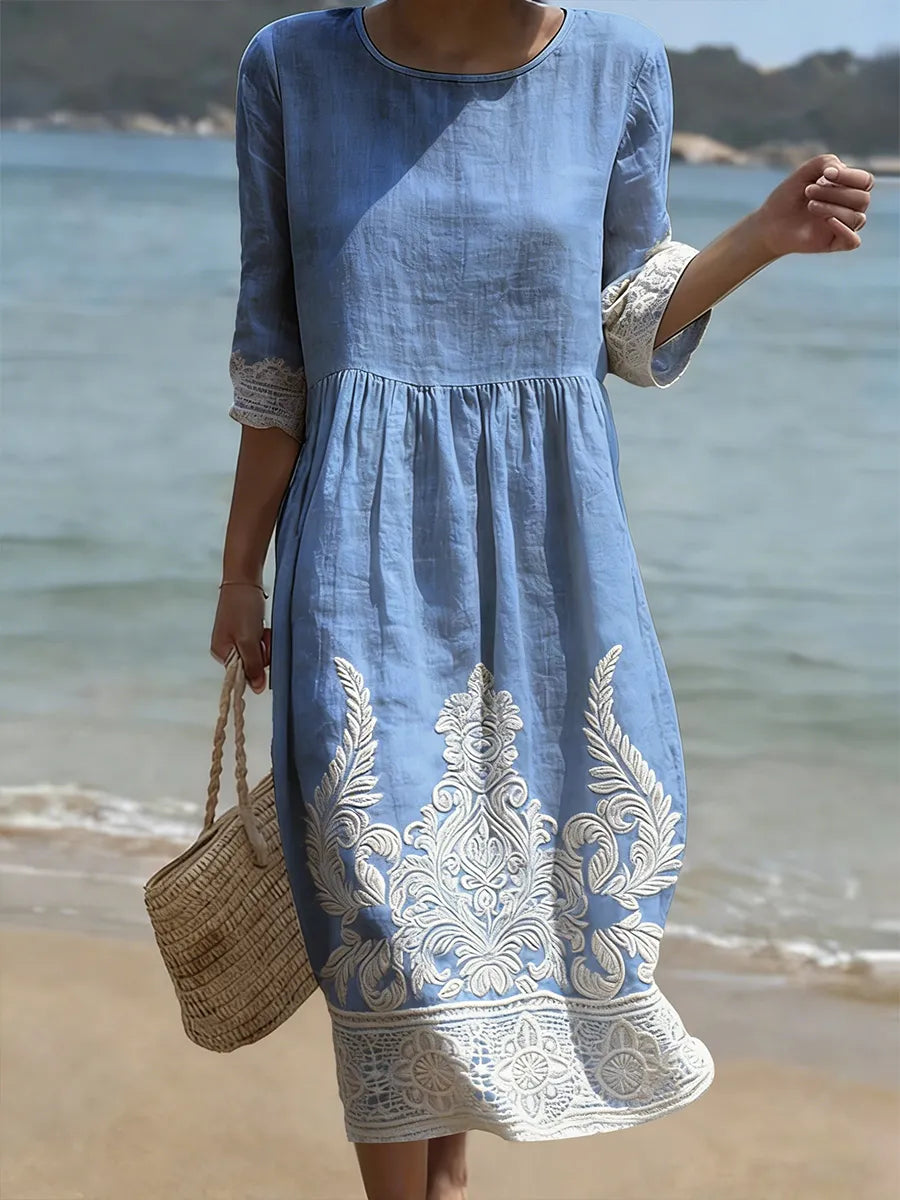 Sylvie · Robe mi-longue à broderie florale et manches trois-quarts