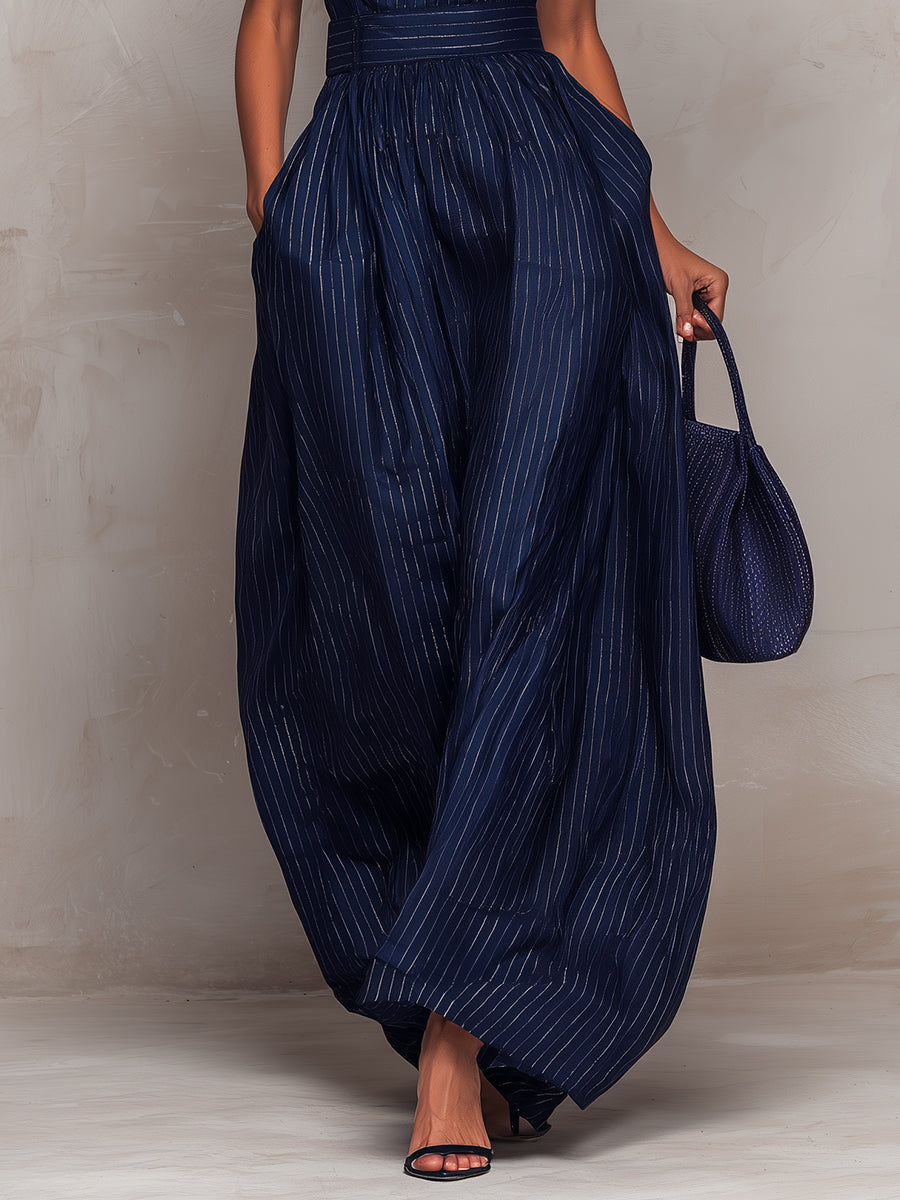 Anna - Mono bleu foncé à rayures avec décolleté en forme de clé et pantalon à jambes larges