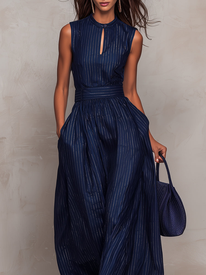 Anna - Mono bleu foncé à rayures avec décolleté en forme de clé et pantalon à jambes larges